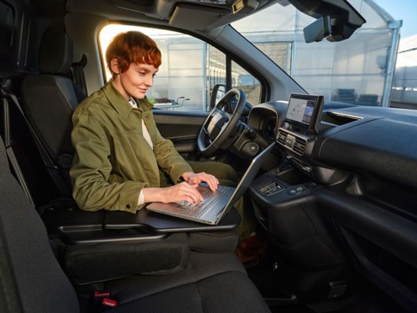 Woman using laptop in Proace